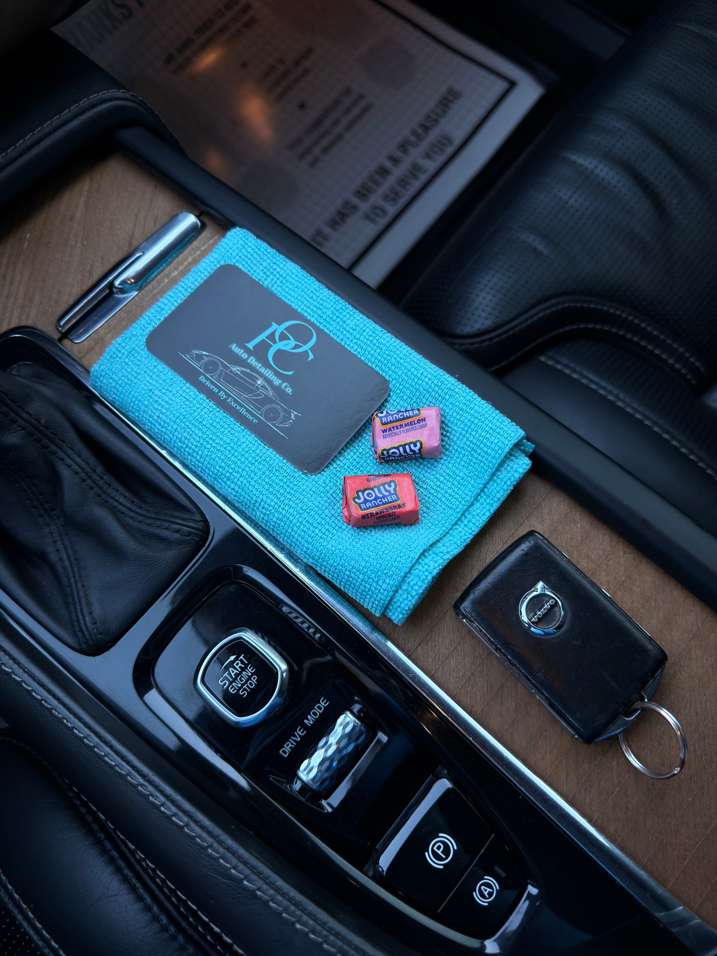 OPC business card and microfiber towel on Volvo console