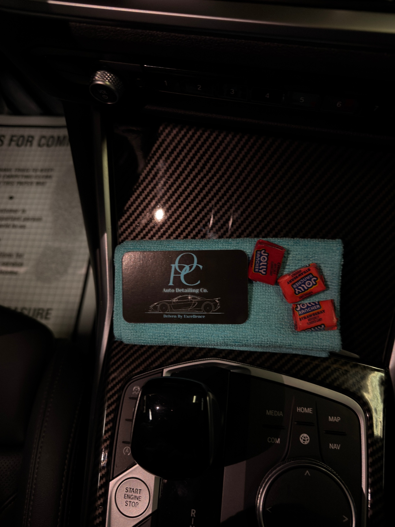 OPC business card, microfiber, and Jolly Ranchers on BMW console