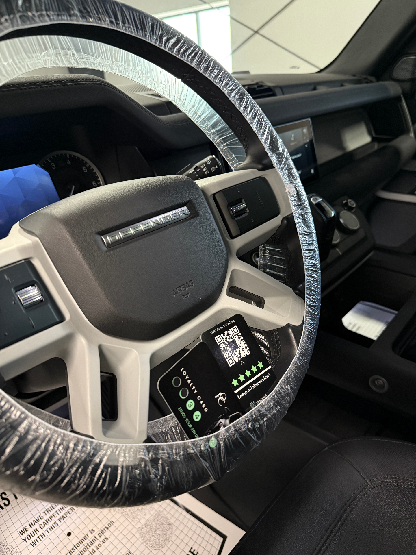 Detailed Land Rover Defender steering wheel and driver area