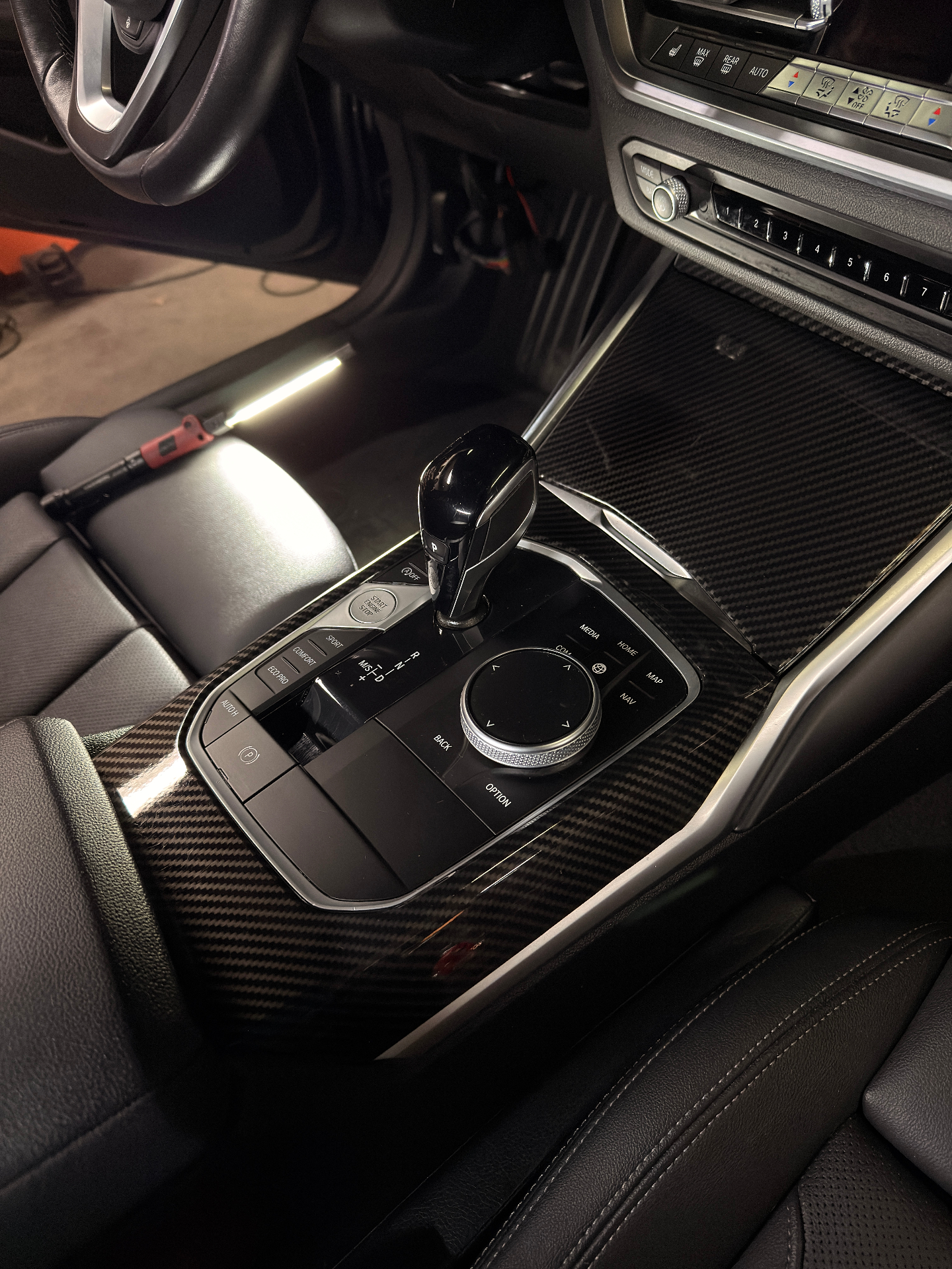 BMW 3 series carbon fiber center console after detail