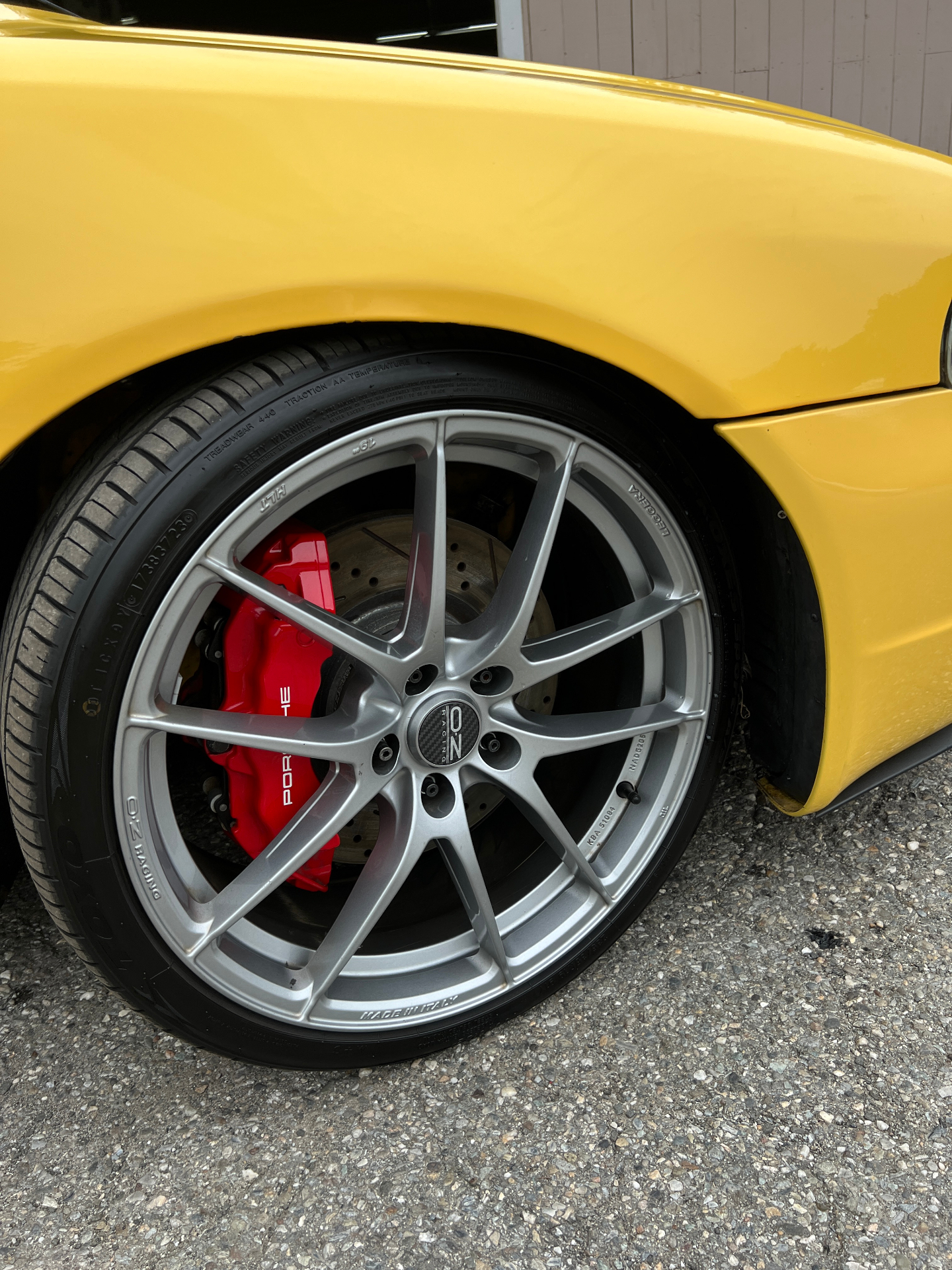 Yellow Audi B5 S4 wheel and brake caliper after detailing