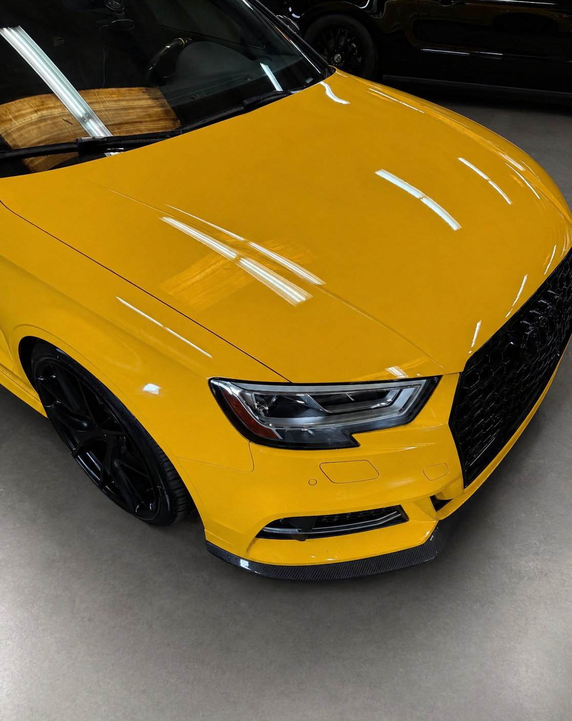 Yellow Audi S3 paint reflection after polish